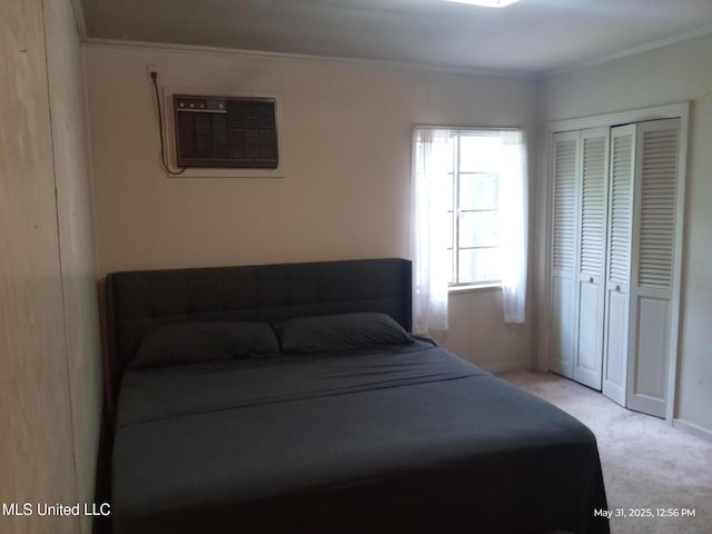 751 Dorgan St, Jackson, MS 39204 - carpeted bedroom with crown molding, a wall mounted air conditioner, and a closet