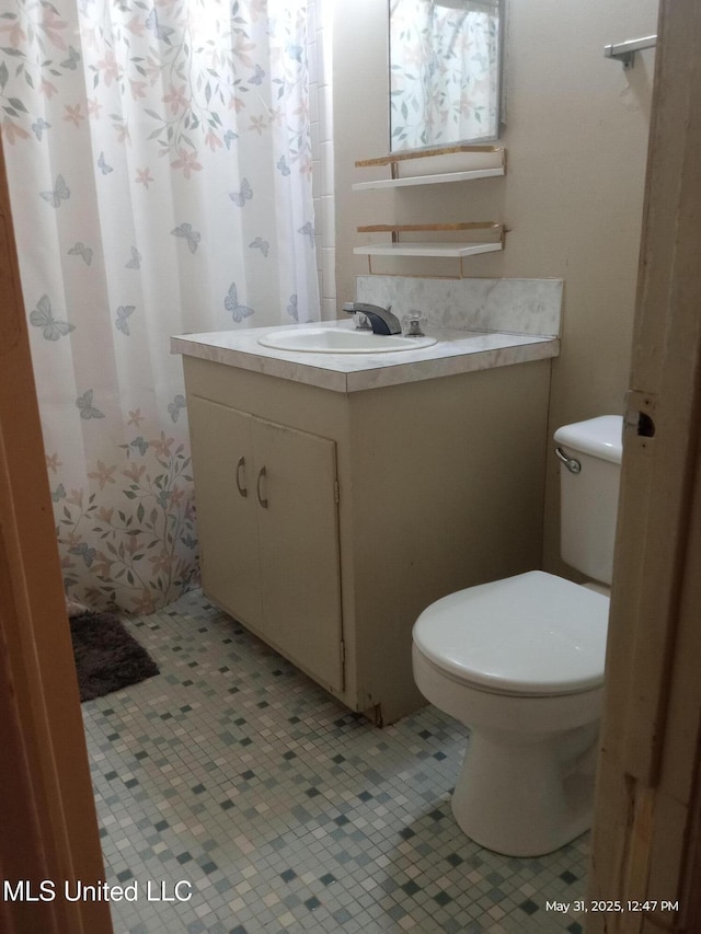 751 Dorgan St, Jackson, MS 39204 - bathroom featuring vanity and toilet