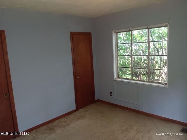 751 Dorgan St, Jackson, MS 39204 - empty room featuring light carpet and baseboards