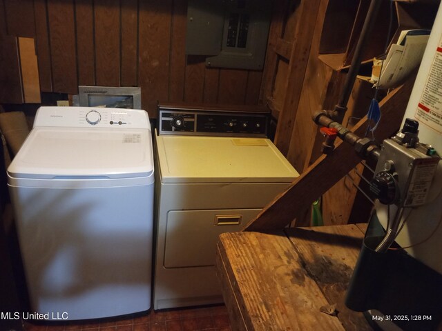 751 Dorgan St, Jackson, MS 39204 - laundry room featuring washer and dryer, electric panel, and wood walls