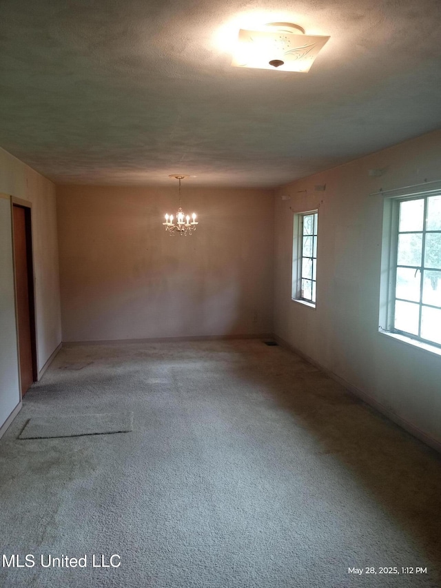 751 Dorgan St, Jackson, MS 39204 - carpeted spare room with a chandelier and a textured ceiling