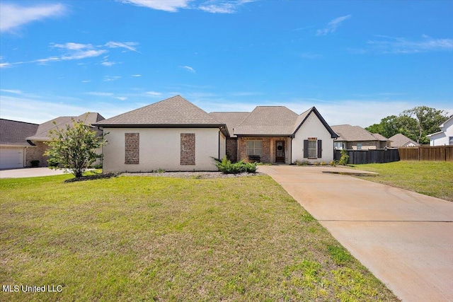 view of front of home featuring a garage and a front lawn