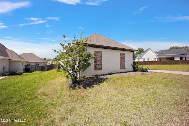 view of home's exterior with a yard