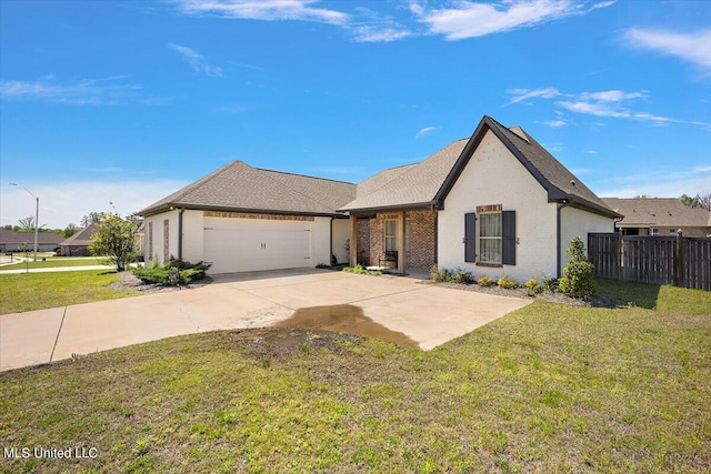 view of front of home with a front yard and a garage