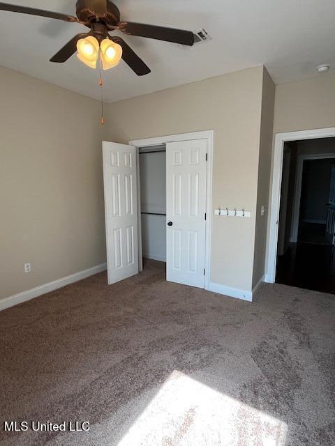 708 Bo Blaze Cv, Brandon, MS 39047 - unfurnished bedroom featuring carpet, baseboards, a closet, and ceiling fan