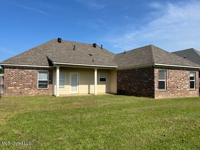 708 Bo Blaze Cv, Brandon, MS 39047 - rear view of property featuring brick siding and a lawn