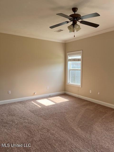708 Bo Blaze Cv, Brandon, MS 39047 - empty room with crown molding, baseboards, carpet, and ceiling fan