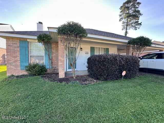 133 Windchase, Brandon, MS 39042 - single story home with a front yard, brick siding, and a chimney