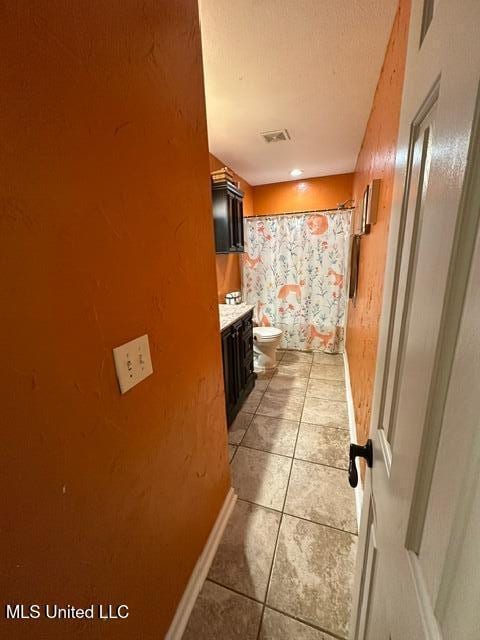 133 Windchase, Brandon, MS 39042 - full bath featuring tile patterned floors, vanity, and a shower with shower curtain