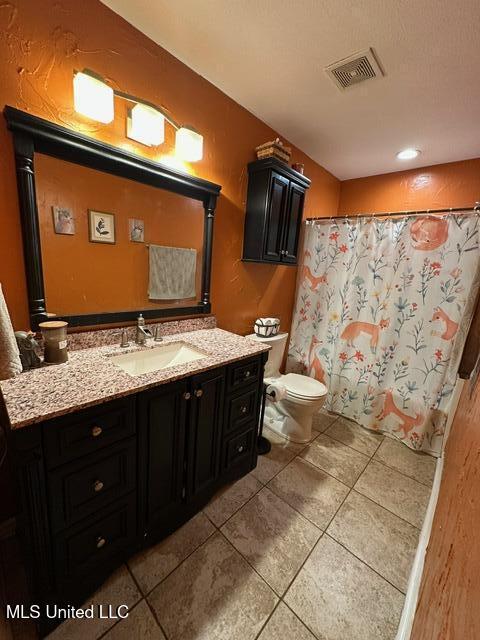 133 Windchase, Brandon, MS 39042 - full bathroom featuring tile patterned flooring, vanity, and a shower with curtain