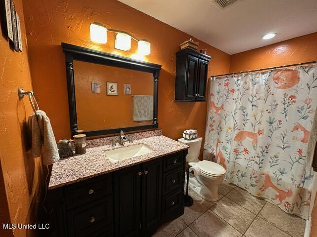 133 Windchase, Brandon, MS 39042 - bathroom featuring tile patterned flooring, vanity, and curtained shower