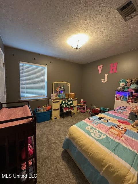 133 Windchase, Brandon, MS 39042 - carpeted bedroom featuring a textured ceiling