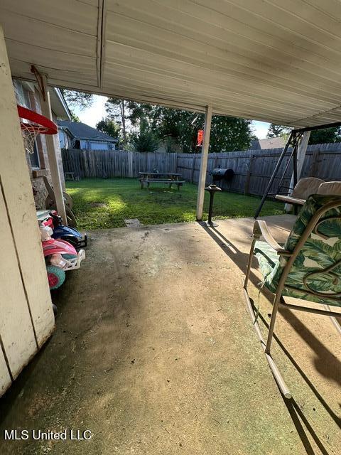 133 Windchase, Brandon, MS 39042 - fenced backyard with a patio area