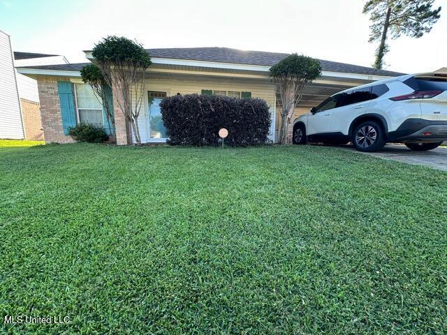 133 Windchase, Brandon, MS 39042 - view of home's exterior with a lawn and brick siding