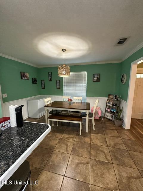 133 Windchase, Brandon, MS 39042 - tiled dining space with wainscoting and crown molding