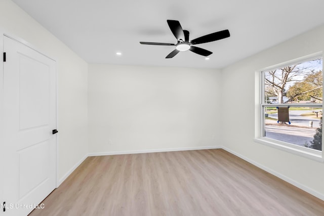 spare room featuring ceiling fan, light wood finished floors, recessed lighting, and baseboards