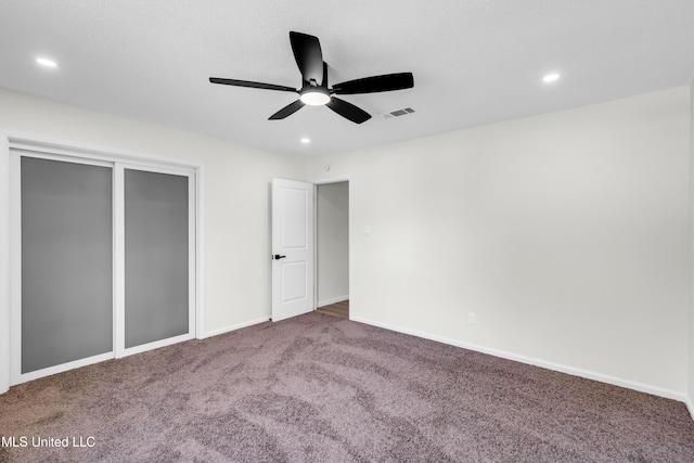 unfurnished bedroom with baseboards, visible vents, carpet flooring, and recessed lighting