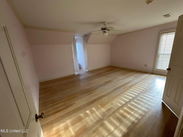 bonus room with light wood-type flooring, lofted ceiling, and ceiling fan