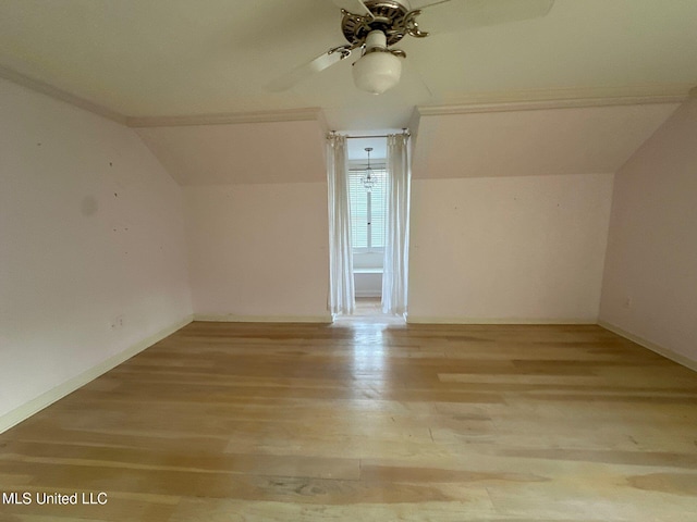 bonus room featuring ceiling fan, light wood-type flooring, and lofted ceiling