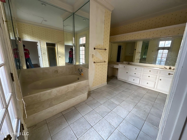 bathroom with a tub to relax in, vanity, tile patterned flooring, and ornamental molding