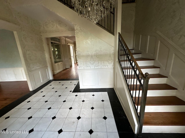 staircase with hardwood / wood-style flooring