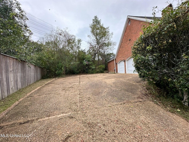 view of yard with a garage