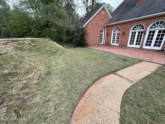 view of yard featuring french doors