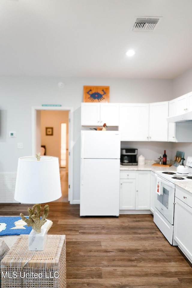 1045 Mckinley St, Waveland, MS 39576 - kitchen featuring white appliances, under cabinet range hood, white cabinets, light countertops, and wood finished floors