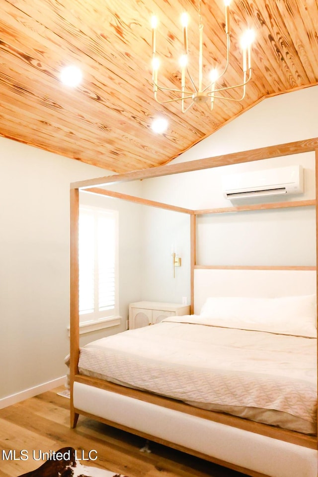 1045 Mckinley St, Waveland, MS 39576 - bedroom featuring a wall unit AC, wood ceiling, lofted ceiling, and wood finished floors