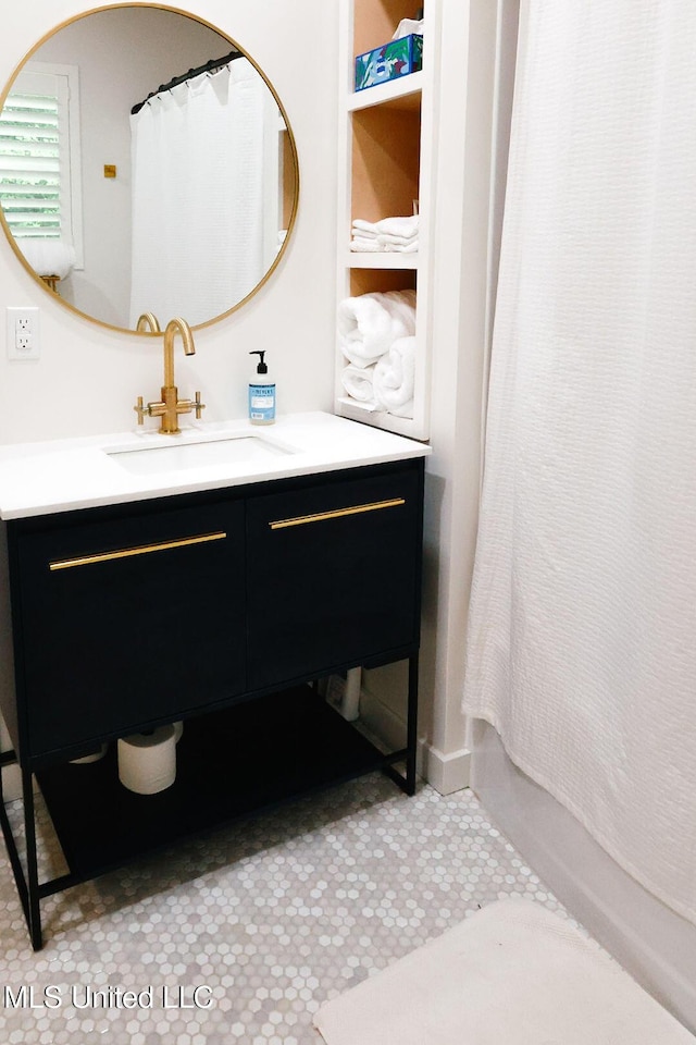 1045 Mckinley St, Waveland, MS 39576 - bathroom with vanity, tile patterned flooring, and shower / bath combo with shower curtain