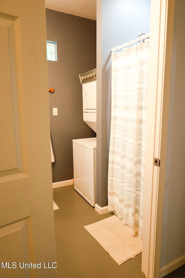 1045 Mckinley St, Waveland, MS 39576 - bathroom with stacked washer and clothes dryer