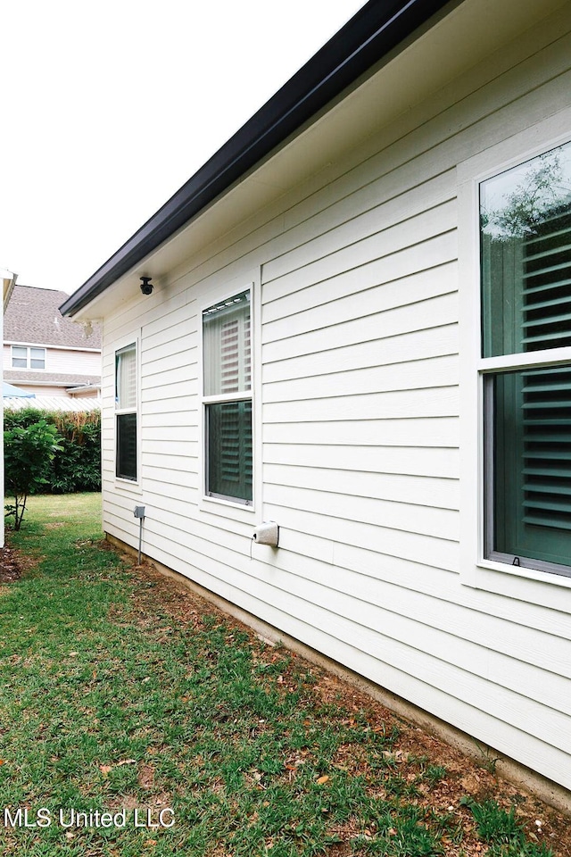 1045 Mckinley St, Waveland, MS 39576 - view of side of home featuring a yard