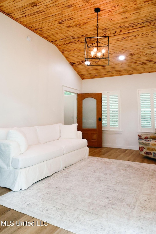 1045 Mckinley St, Waveland, MS 39576 - living room with wooden ceiling, a chandelier, wood finished floors, vaulted ceiling, and plenty of natural light