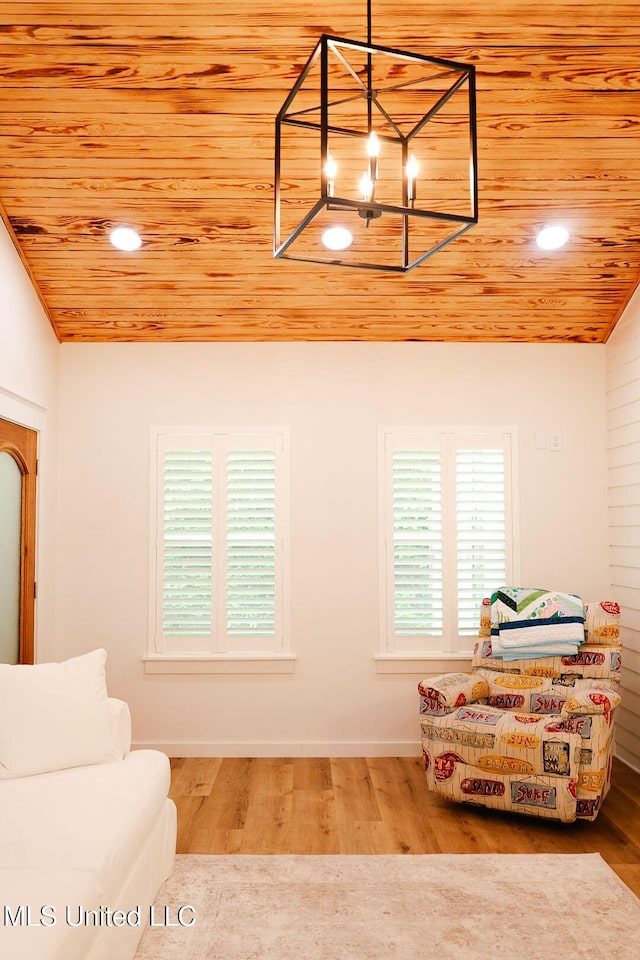 1045 Mckinley St, Waveland, MS 39576 - living area with a chandelier, wooden ceiling, and wood finished floors