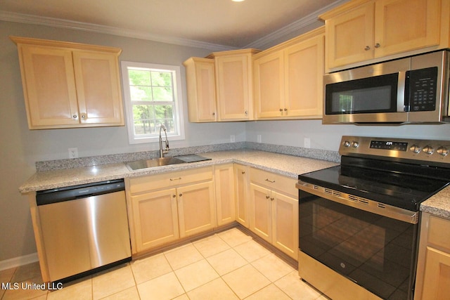 kitchen featuring light brown cabinetry, light tile patterned flooring, a sink, stainless steel appliances, and ornamental molding