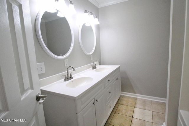 bathroom featuring double vanity, a sink, crown molding, and tile patterned flooring