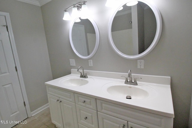 bathroom featuring a sink, tile patterned flooring, crown molding, and double vanity
