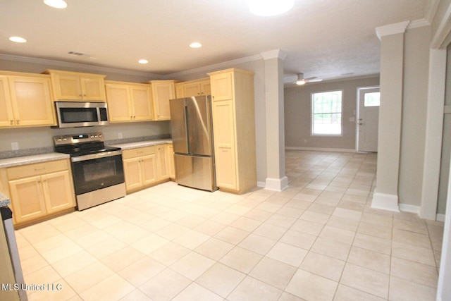kitchen with light brown cabinetry, light countertops, stainless steel appliances, light tile patterned floors, and ornamental molding