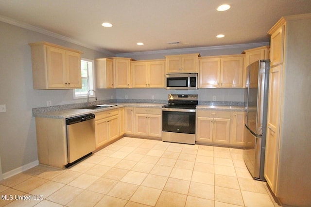 kitchen featuring a sink, light brown cabinetry, crown molding, and stainless steel appliances