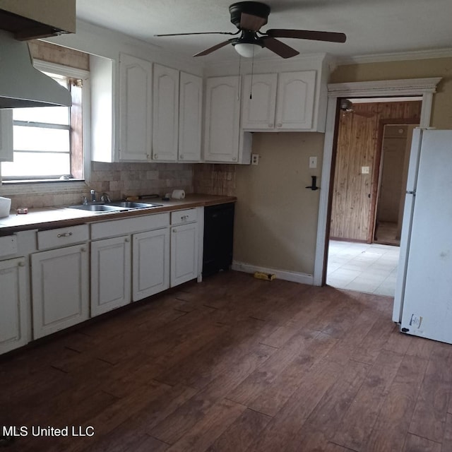 kitchen with white cabinetry, light wood-type flooring, sink, and white refrigerator