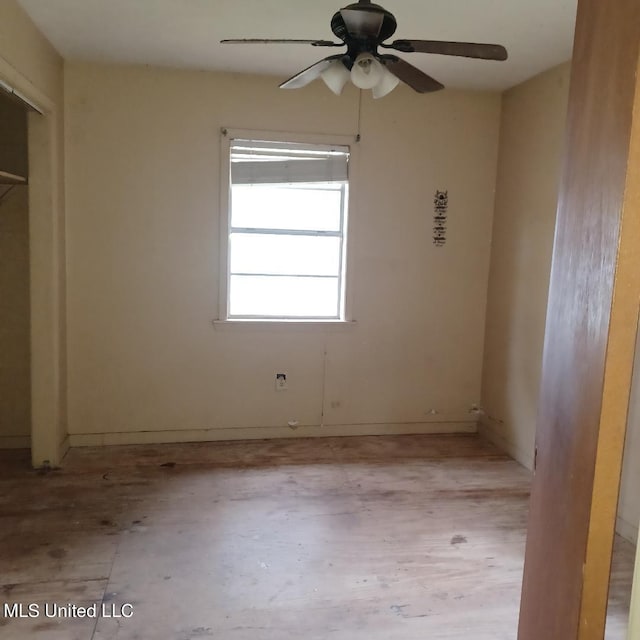 unfurnished room with ceiling fan and light hardwood / wood-style floors