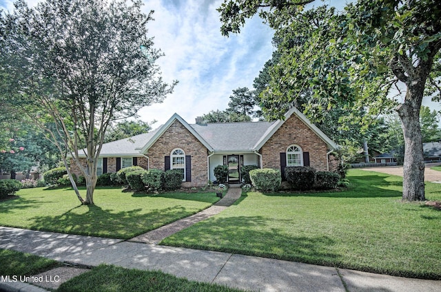 320 Woodhollow Cv, Brandon, MS 39047 - single story home with brick siding, a front lawn, and roof with shingles