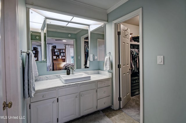 320 Woodhollow Cv, Brandon, MS 39047 - bathroom with crown molding, vanity, and a spacious closet