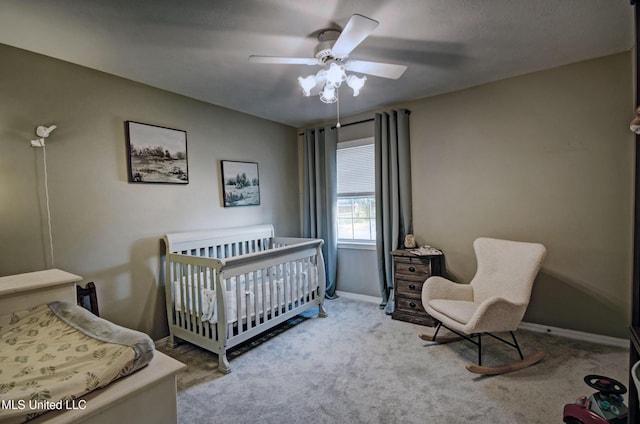 320 Woodhollow Cv, Brandon, MS 39047 - bedroom with carpet floors, a nursery area, and ceiling fan