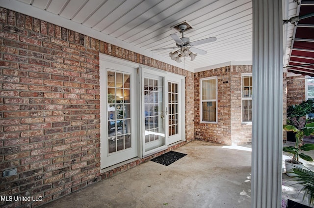 320 Woodhollow Cv, Brandon, MS 39047 - view of exterior entry with ceiling fan, brick siding, and a patio area