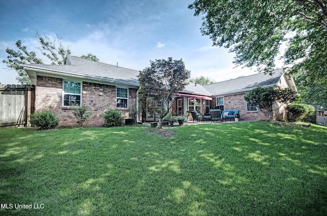 320 Woodhollow Cv, Brandon, MS 39047 - rear view of property with brick siding, a patio, and a shingled roof