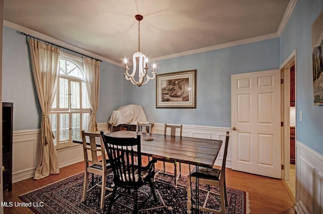 320 Woodhollow Cv, Brandon, MS 39047 - dining room with a chandelier, light wood finished floors, ornamental molding, healthy amount of natural light, and a decorative wall