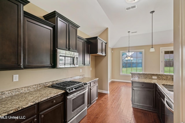 4913 Deer Run Rd, Olive Branch, MS 38654 - kitchen with appliances with stainless steel finishes, lofted ceiling, dark wood-type flooring, and dark brown cabinetry