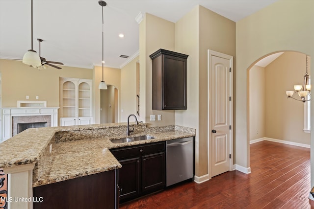 4913 Deer Run Rd, Olive Branch, MS 38654 - kitchen with dishwasher, a sink, arched walkways, dark wood-style flooring, and open floor plan