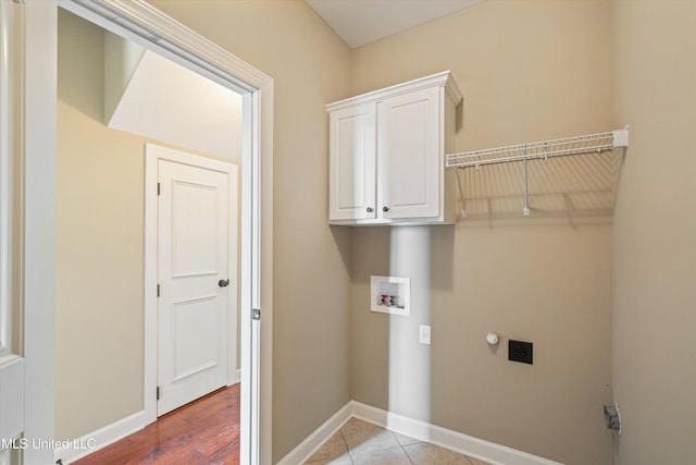 4913 Deer Run Rd, Olive Branch, MS 38654 - washroom with electric dryer hookup, cabinet space, baseboards, and hookup for a washing machine